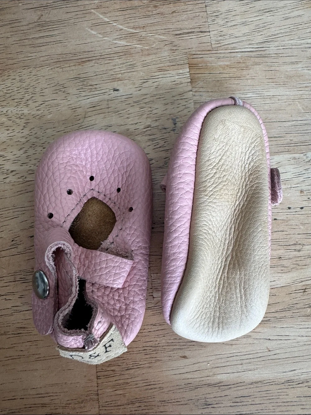 Duchess & Fox soft pink infant shoes.